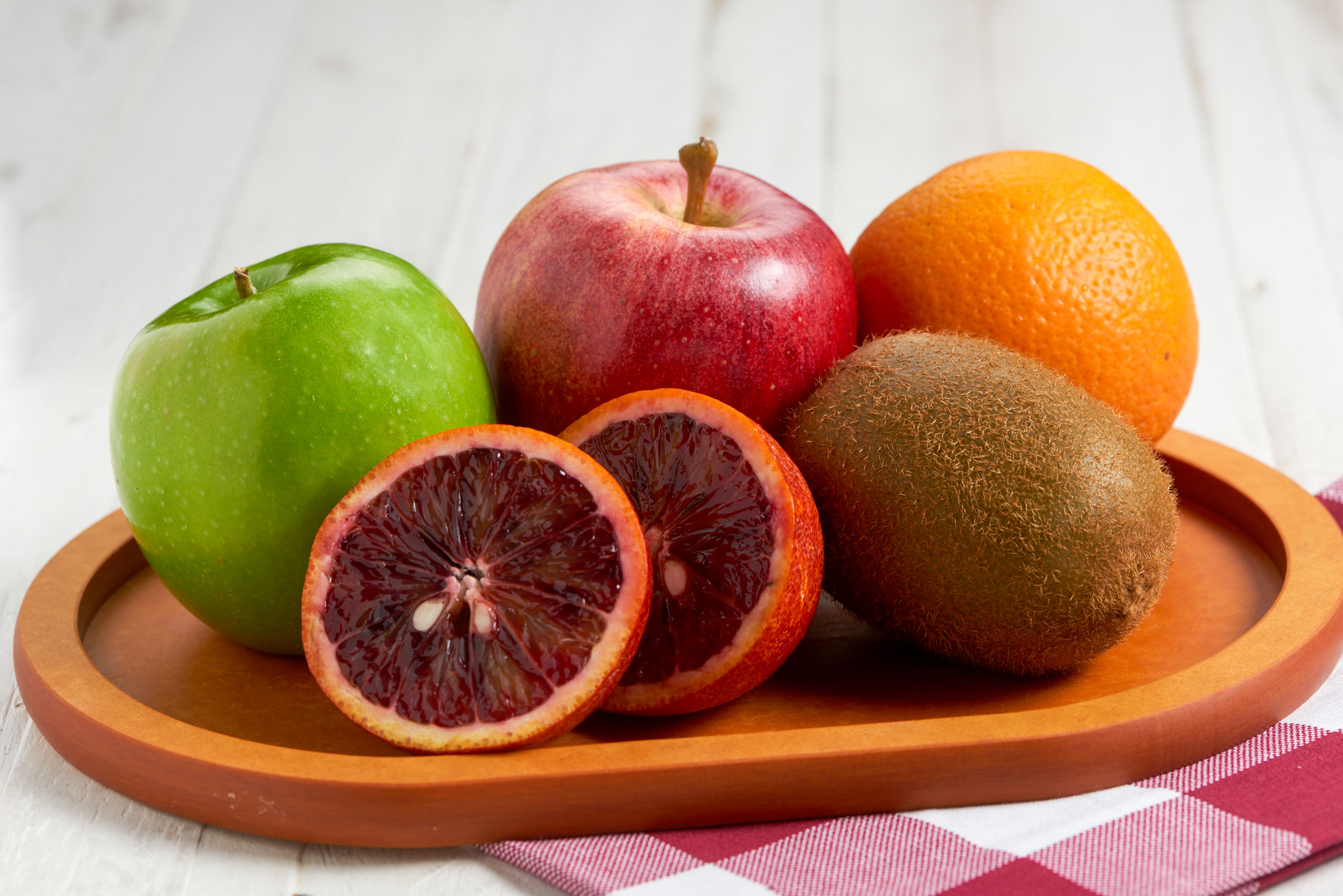 winter medley fruit basket with blood orange, kiwi, apples, and
