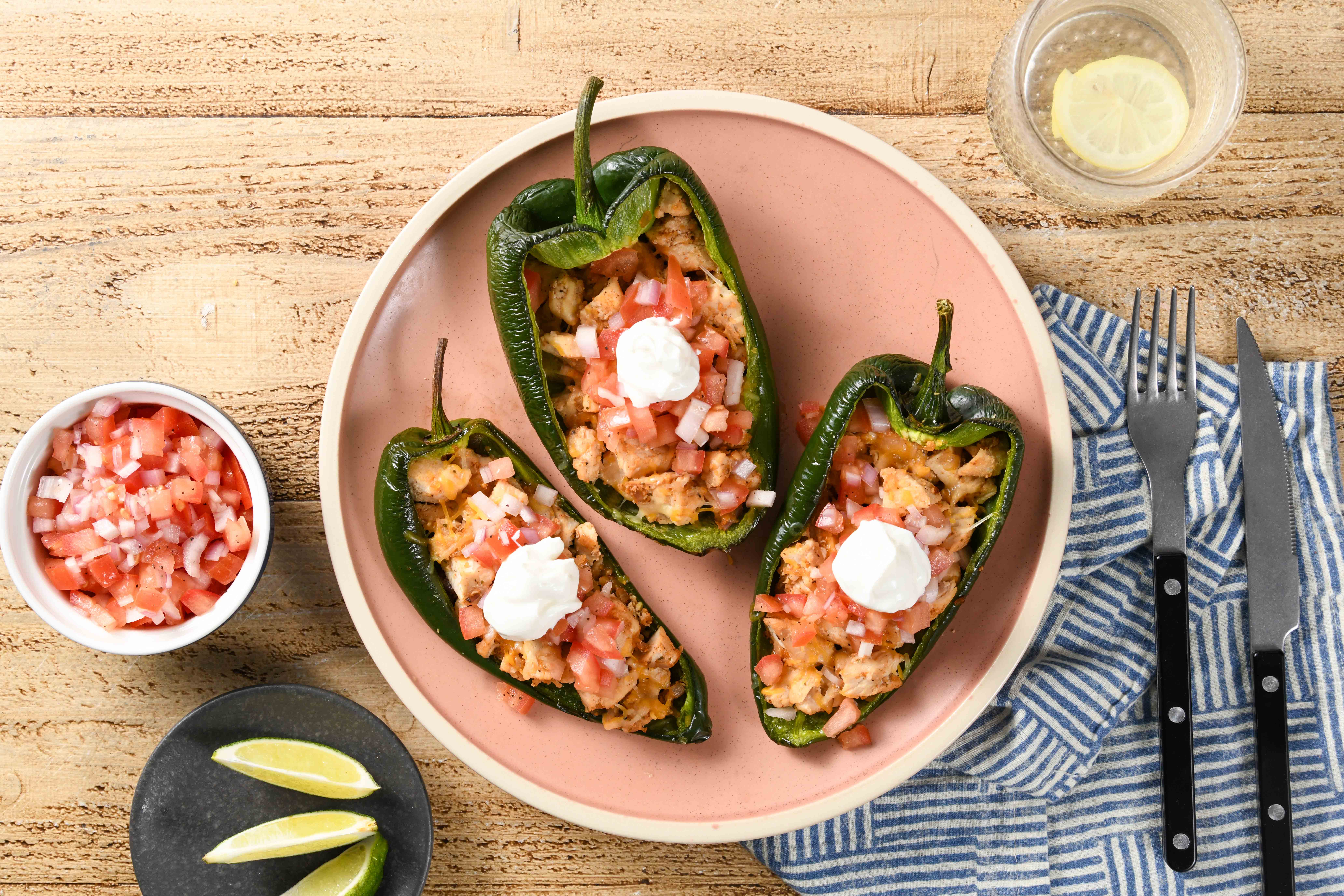 Chicken Taco Stuffed Peppers with pico de gallo and sour cream