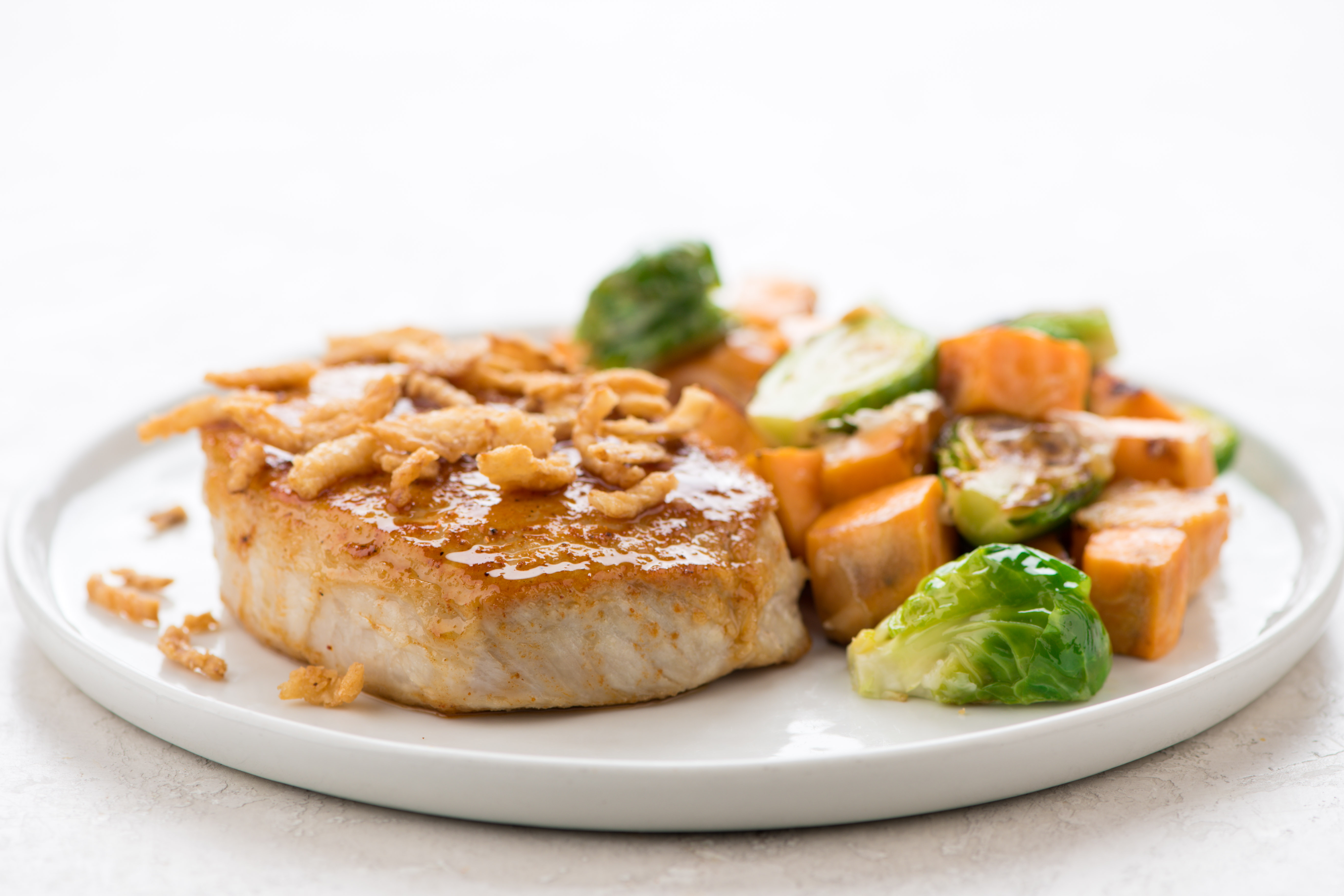 Chili Brown Sugar Pork Chop with Roasted Sweet Potatoes and Brussels